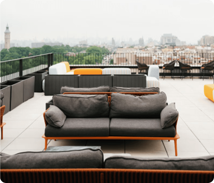Venue terrace with sofas and skyline views.