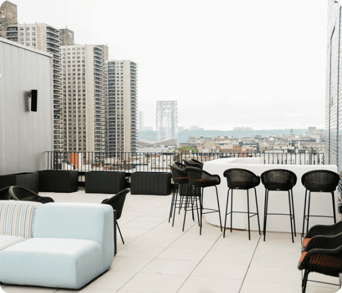 Venue lounge area with high tables and urban views.